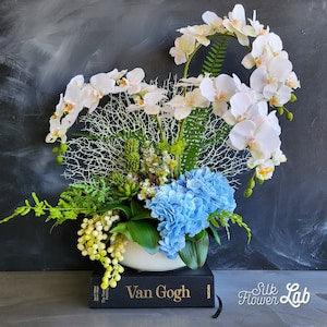 Nautical beach theme orchid arrangement with faux coral fan, Phalaenopsis orchid, real touch blue hydrangea, fake succulent in ceramic vase