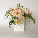 Peach and cream floral arrangement; real touch orchids; blush hydrangea arrangement