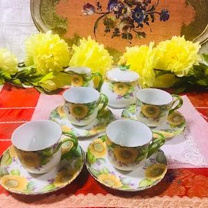 Sold individually vintage sunflowers hand painted with twisted handle porcelain Klausenburg , tea cups and saucers, creamer and sugar bowl,