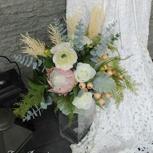 Blush and white brides bouquet King Protea, peony