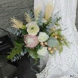 Blush and white brides bouquet King Protea, peony