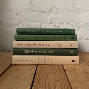 Neutral staging book stack, green and beige styling books, mantle decor, library decor, real prop books for office decor, coffee table books