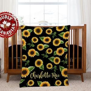 Personalized sunflower minky baby blanket in black and yellow floral. It's so buttery soft!