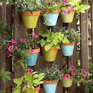 Transform a dull fence. Hangapot, hidden flower pot hanger. Vertical Gardens, DIY. Hang Clay Terra Cotta pots Anywhere! 12 pack plant clips.