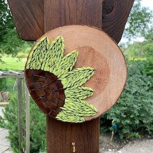 Stained glass mosaic yellow sunflower on wood cookie slice