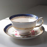 Royal Grafton k1529 cobalt blue teacup and saucer with bouquet of roses