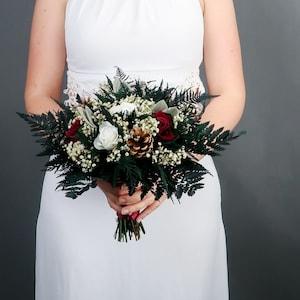 Burgundy and white winter wedding bridal bouquet pine cones real preserved roses and greenery real flowers woodland wedding