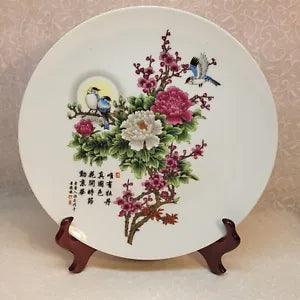 Decorative porcelain plate with peony flowers and two blue birds