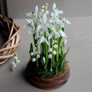 Snowdrops and lily of the valley in glass dome, Porcelain flowers, rustic floral arrangement, botanical table centerpiece, nature inspired