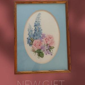 Floral Spray Of Delfiniums, Roses & Violets, Cross Stitched, And Framed In A Blue Matte 12 3/4" X 17"