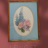 Floral Spray Of Delfiniums, Roses & Violets, Cross Stitched, And Framed In A Blue Matte 12 3/4" X 17"