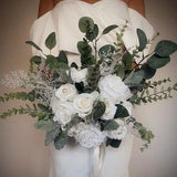 White rose and peony, eucalyptus natural bridal bouquet , green foliage subtle pearl beads and brooch detail , white wedding flowers.