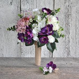 Bridal bouquet with purple cherry blossoms hydrangea and white roses for a rustic wedding ceremony