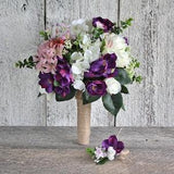 Bridal bouquet with purple cherry blossoms hydrangea and white roses for a rustic wedding ceremony