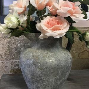 Aged Metal Vase with artificial Rose Bouquet