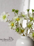 Cosmos white artificial flower out of cold porcelain flower spore
