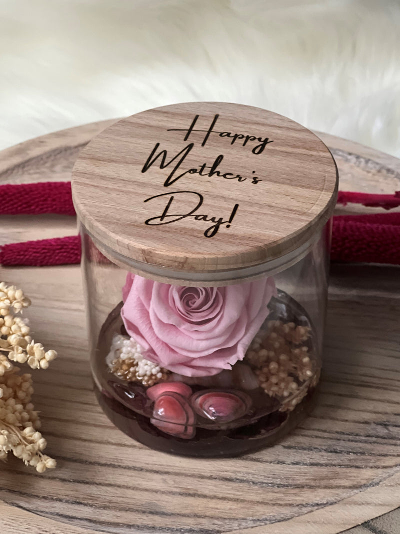Glass vase with pink preserved rose and engraved wooden lid, 'Happy Mother's Day' text