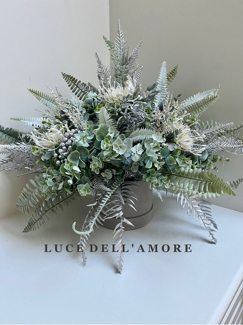 Winter Wonderland floral arrangement presented in a hat box FLOWER DELIVERY