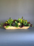 Faux succulent arrangement in a wood bowl faux plants