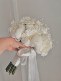 white bridal bouquet and boutonniere with pearl detail Bouquet