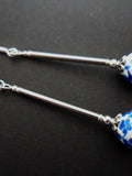 A pair of hand made cute long dangly blue flower porcelain earrings with 925 solid silver hooks. FLOWER DELIVERY