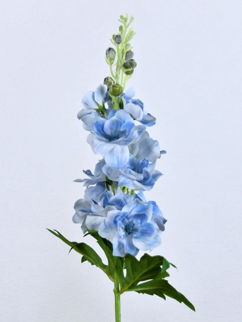 Artificial light blue delphinium flower stem with green leaves