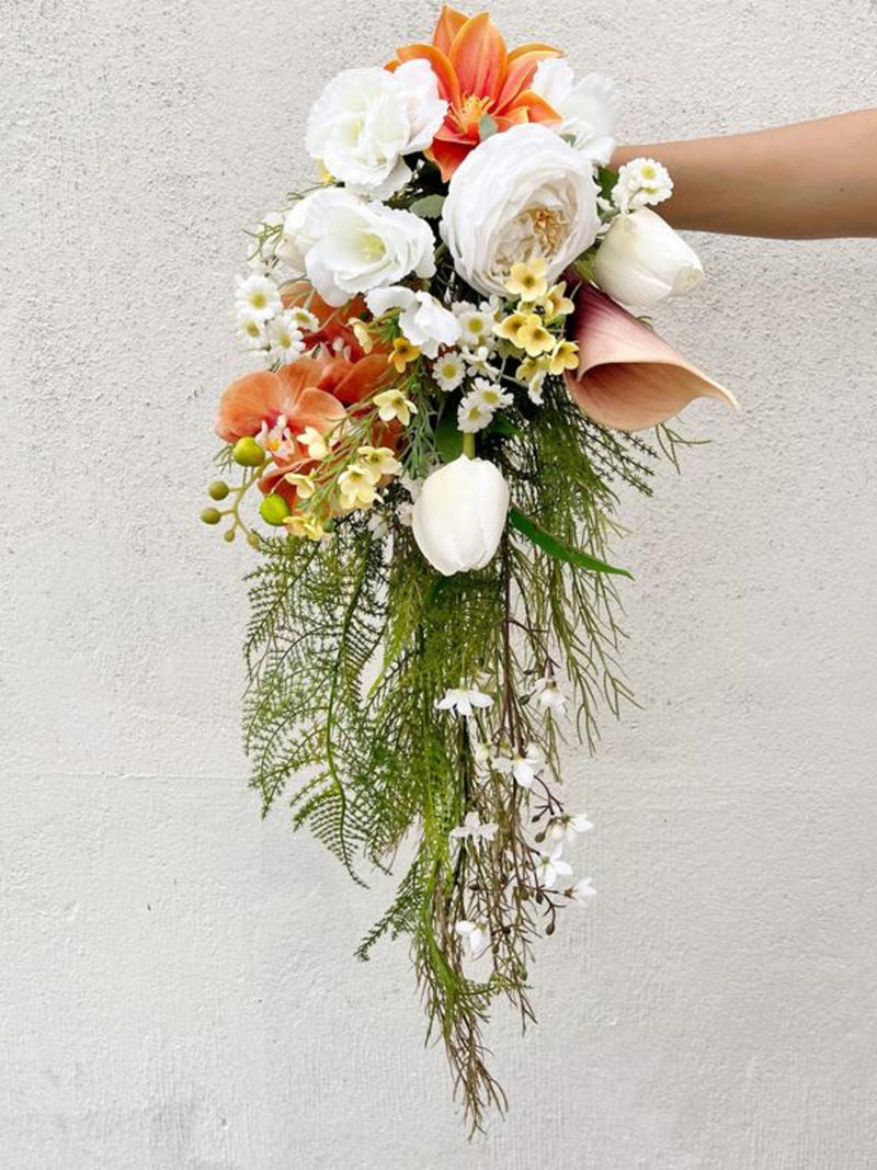 Elegant Cascading Bouquet: White Roses, Apricot Orchids & Lush Green Foliage Bouquet