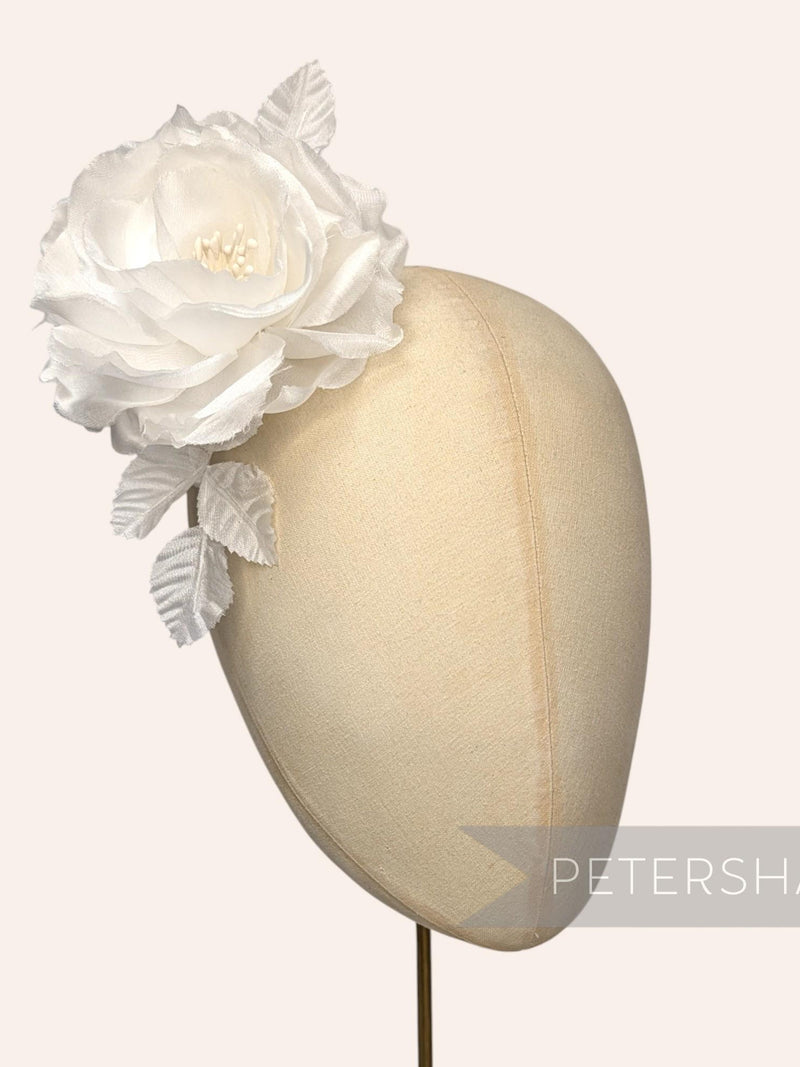 Ivory silk flower fascinator with large rosette on beige millinery headband mount