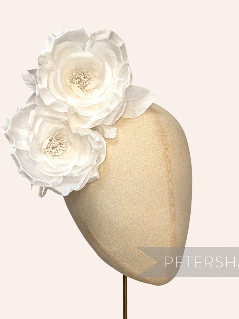 Ivory silk fascinator with two layered rose flowers on a mesh headband mount