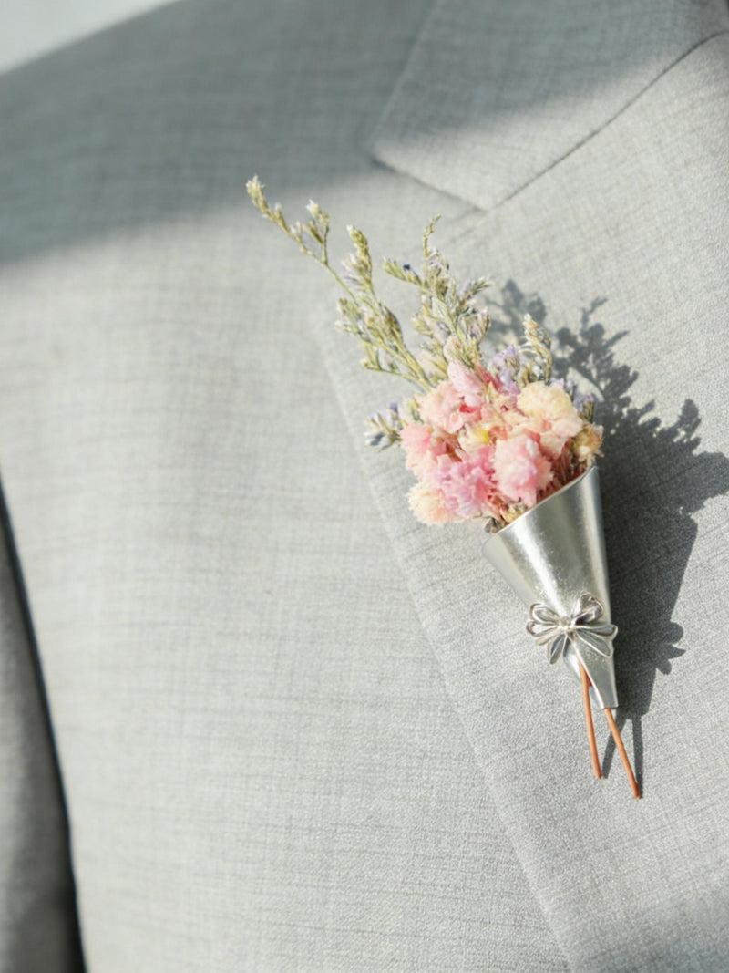 Floral brooch with pink and blue mini flowers and a silver bow pin