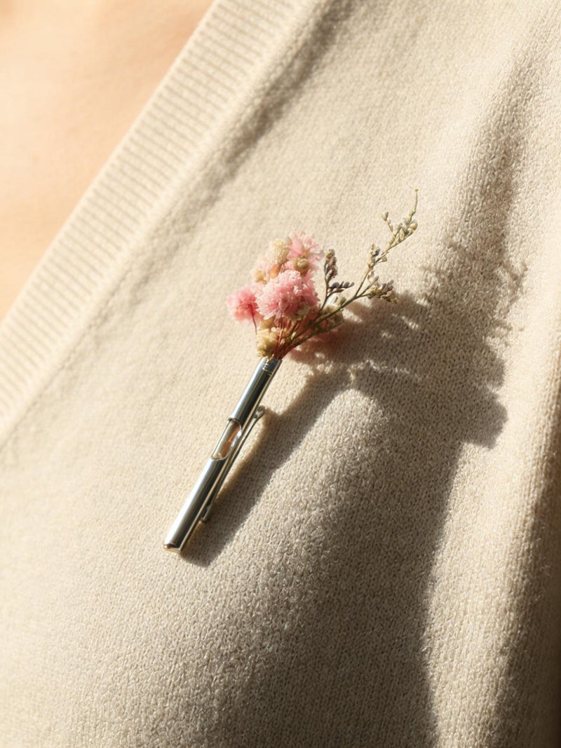 Handmade floral brooch pin with small pink blossoms and green stems