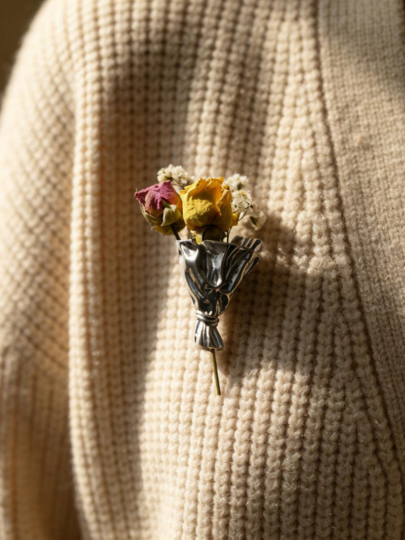 Floral bouquet brooch pin with small mixed-color flowers and silver stem