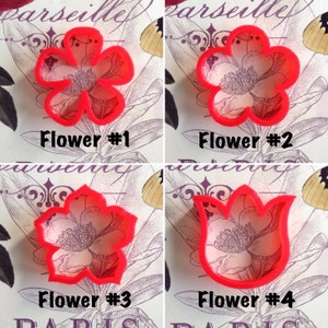 Set of red flower cookie cutters with embossed center detail