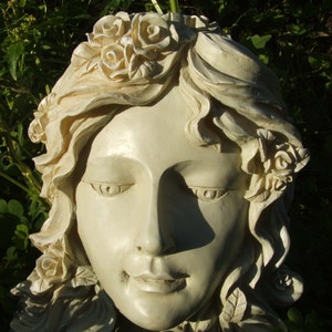 Angel face wall plaque latex mold, cream-toned relief with curled hair and closed eyes