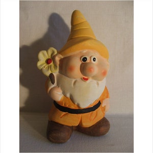 Latex gnome mold shaped like a gnome holding a flower