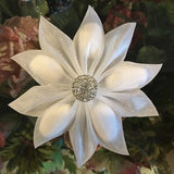 White fabric confetti flower wedding favor with glitter center