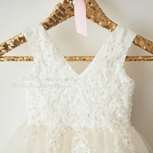 White lace flower girl dress with V-neck, short sleeves, beaded bodice
