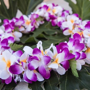 Purple & white silk plumeria lei with green leaves