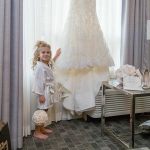 White junior bridesmaid robe with short sleeves and flowing tulle layered skirt