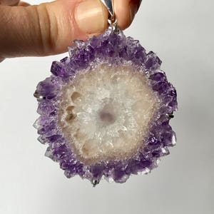 Sterling silver amethyst pendant with round purple crystal slice