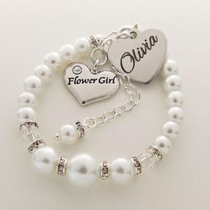 Flower girl bracelet with white pearl beads and silver heart charms, name Olivia
