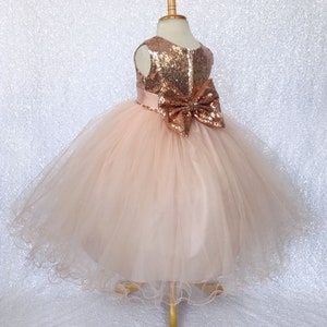 Sleeveless rose gold sequin bow flower girl dress with tulle skirt