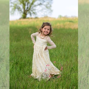 Ivory lace long-sleeve flower girl dress with layered tulle skirt and pink floral print