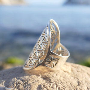 Sterling silver flower-of-life geometric ring with floral lattice pattern, wide band