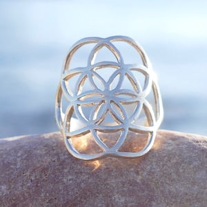 Sterling silver ring with openwork flower of life geometric pattern