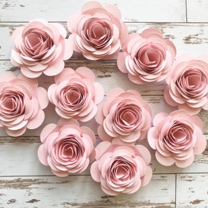 Pink rolled paper flower garland with loose rosette blooms