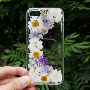 Clear phone case with dried pressed daisies and purple flowers