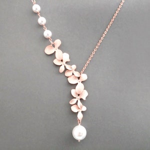 Lariat necklace with white pearl orchid flower design and rose gold chain