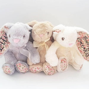 Plush bunny gift set with three pastel stuffed bunnies in bow ties