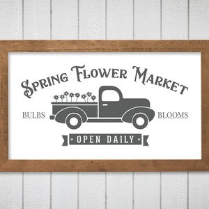 Rustic horizontal sign graphic: truck with 'Spring Flower Market' and 'Open Daily'